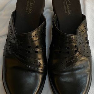 Clarks clogs.